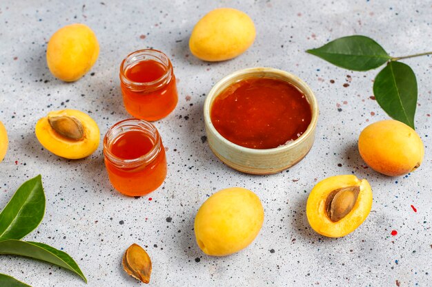 Homemade delicious apricot jam with fresh apricot fruits.