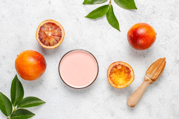 Homemade delicious blood orange glaze with fresh blood orange fruits.