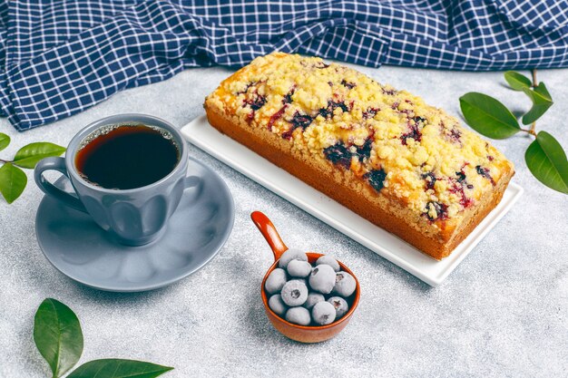 Homemade delicious blueberry crumble cake with frozen blueberries, top view