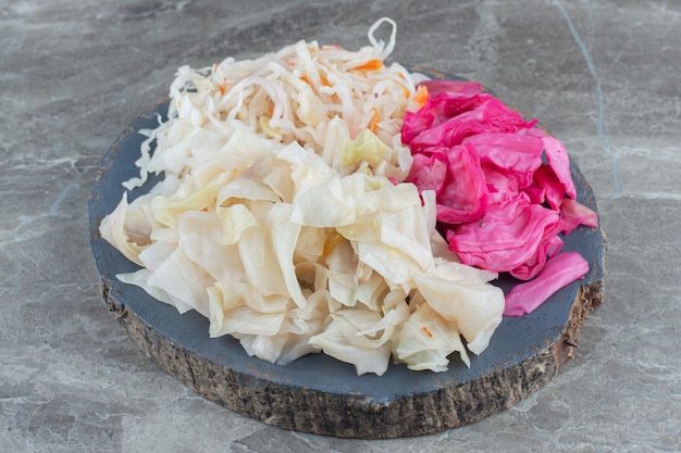 Free photo homemade fresh cabbage pickle on wooden board.