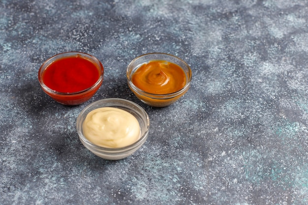 Free photo homemade ketchup,mustard and mayonnaise sauce.