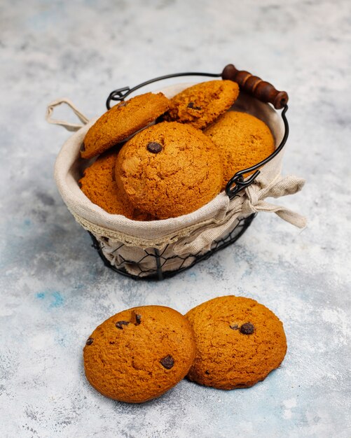 Homemade oatmeal cookies with chocolate chips on concrete  