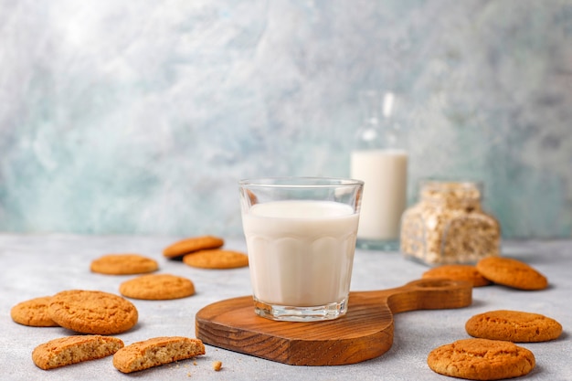 Free photo homemade oatmeal cookies with a cup of milk.