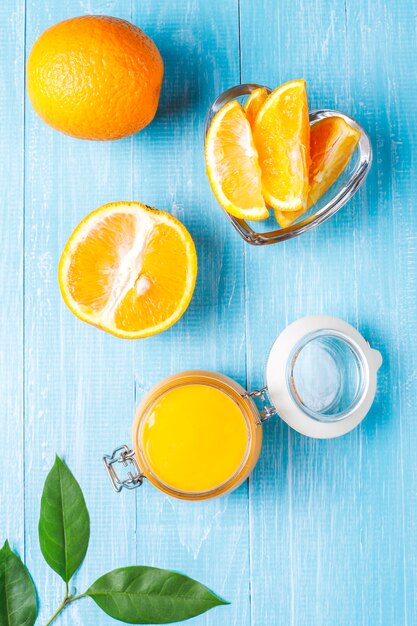 Homemade orange curd with juicy oranges.