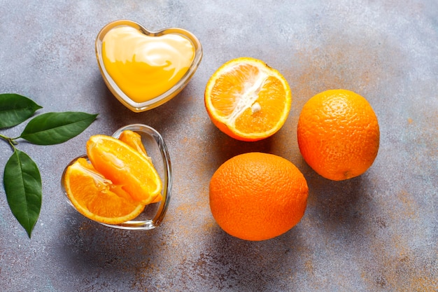 Free photo homemade orange curd with juicy oranges.