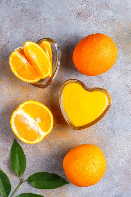 Homemade orange curd with juicy oranges.