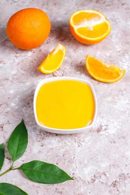 Free photo homemade orange curd with juicy oranges.