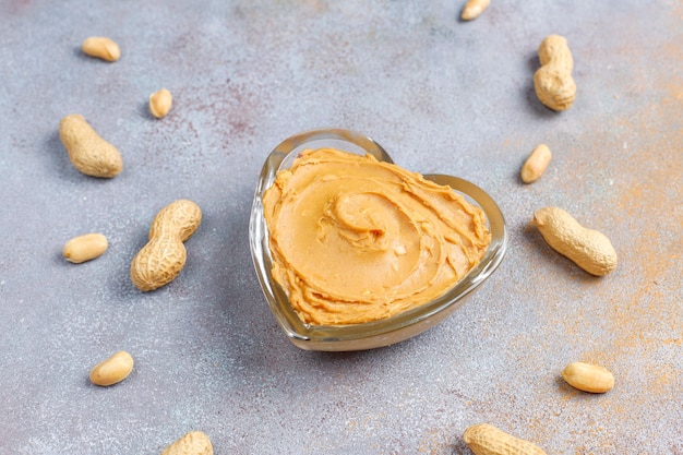 Homemade organic peanut butter with peanuts.