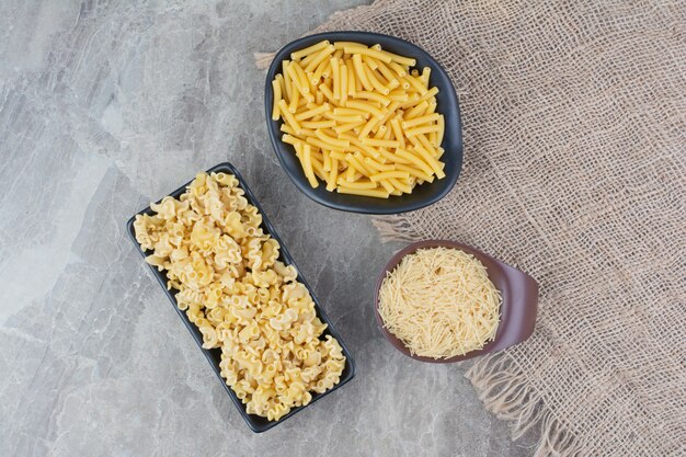 Homemade pastas in a black ceramic platter