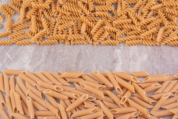 Homemade pastas isolated on marble space. 