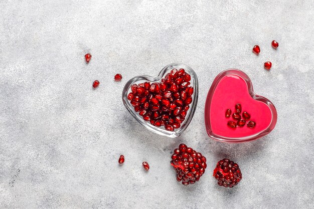 Homemade pomegranate curd or topping with pomegranate seeds.