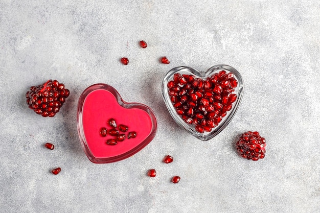 Homemade pomegranate curd or topping with pomegranate seeds.