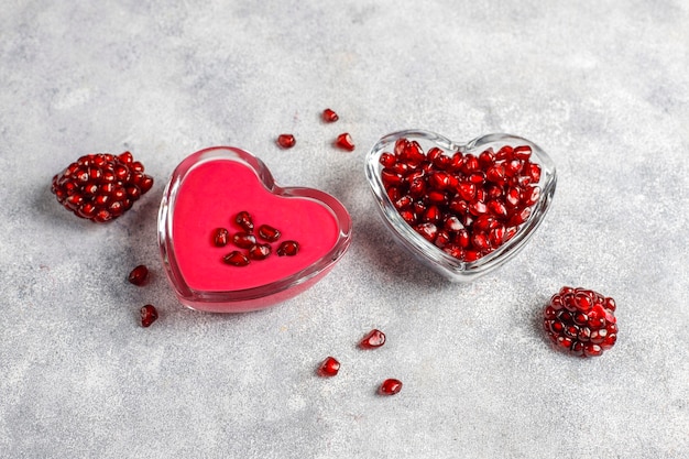 Homemade pomegranate curd or topping with pomegranate seeds.