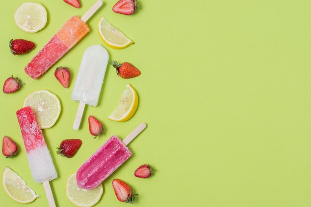 Homemade popsicle ice cream with lemon and strawberry flavours