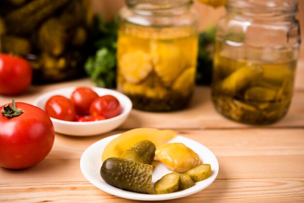 Homemade preserves on wooden background