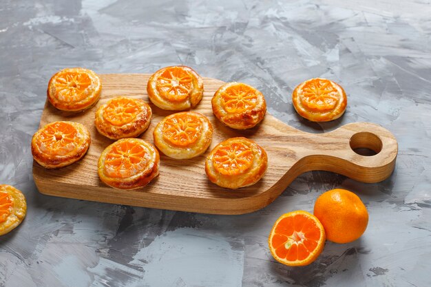 Homemade puff pastry with tangerine slices.