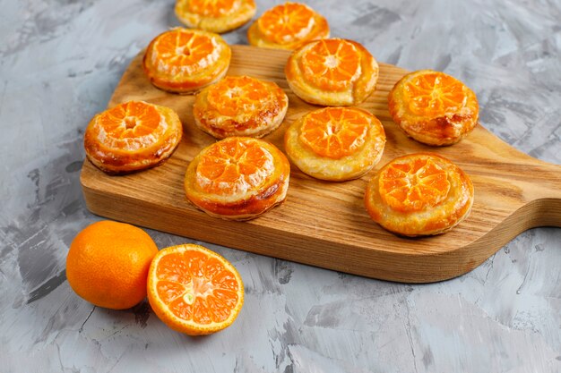 Homemade puff pastry with tangerine slices.