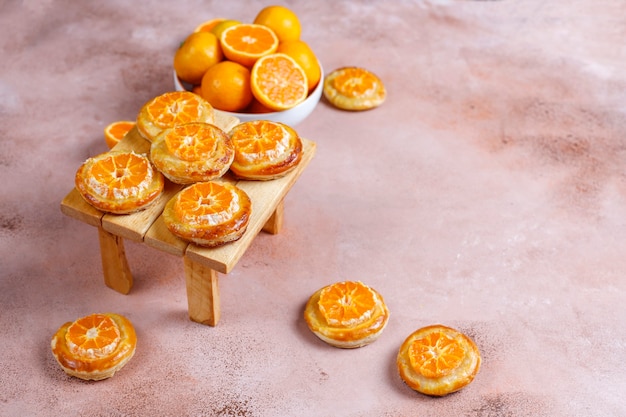 Homemade puff pastry with tangerine slices.