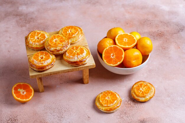 Homemade puff pastry with tangerine slices.