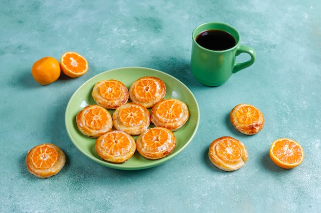 Homemade puff pastry with tangerine slices.