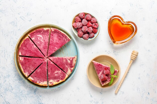 Homemade raspberry cheesecake with honey.