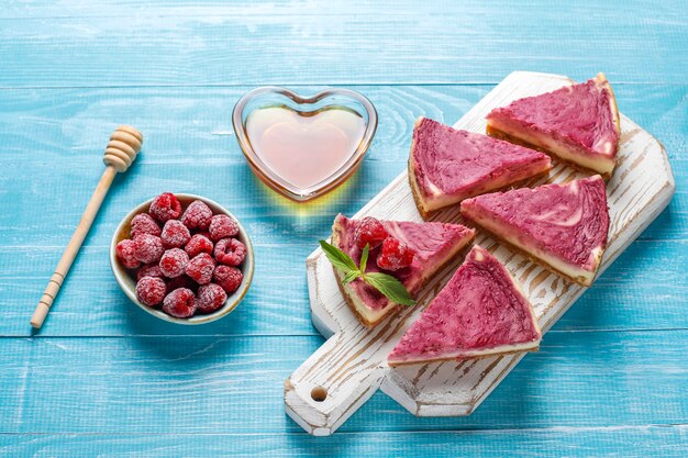 Homemade raspberry cheesecake with honey.