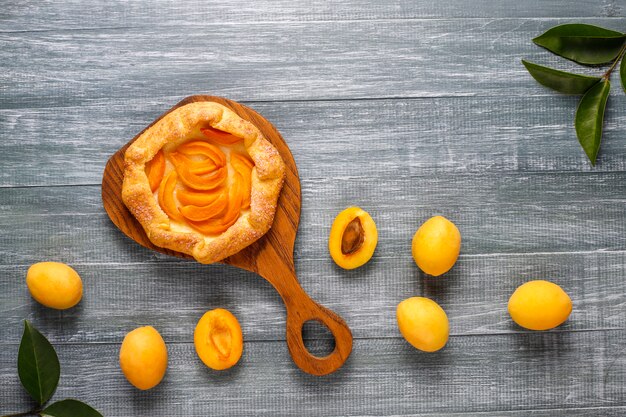 Homemade rustic apricot galette with fresh organic apricot fruits