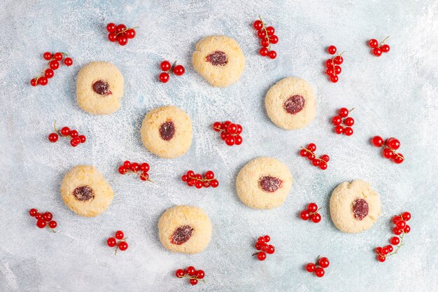 Homemade rustic red currant jam filling cookies with coconut