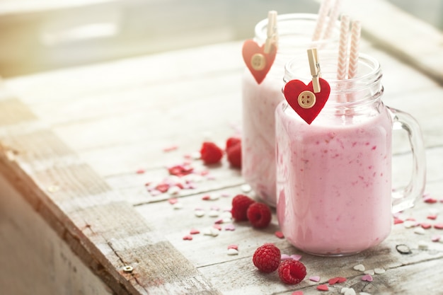 Homemade smoothie with raspberry in jars. Love, eating or valent