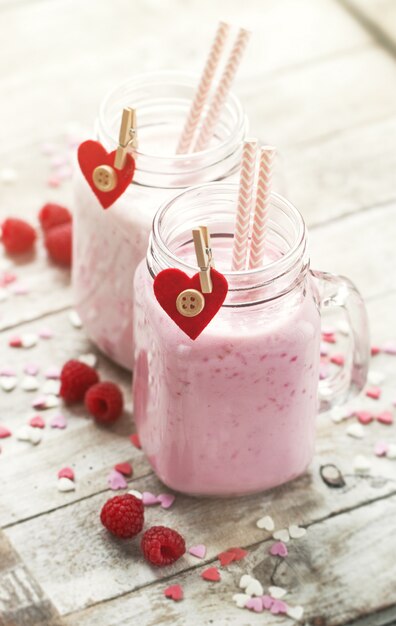 Homemade smoothie with raspberry in jars. Love, eating or valent