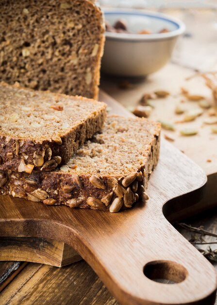 Homemade sunflower seed bread on chopping board