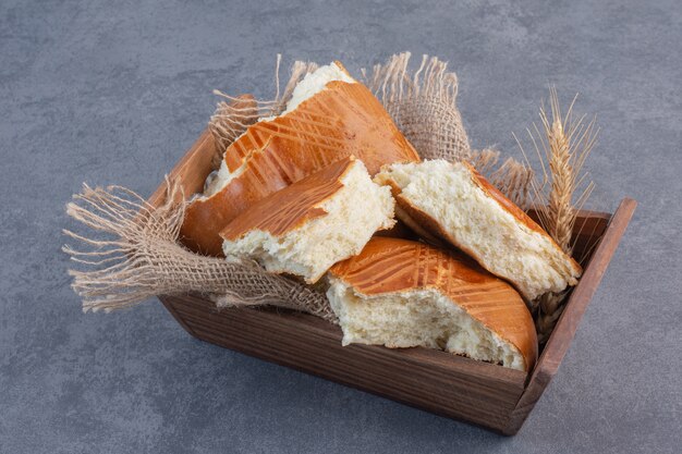 Homemade sweet pastries in wooden box.