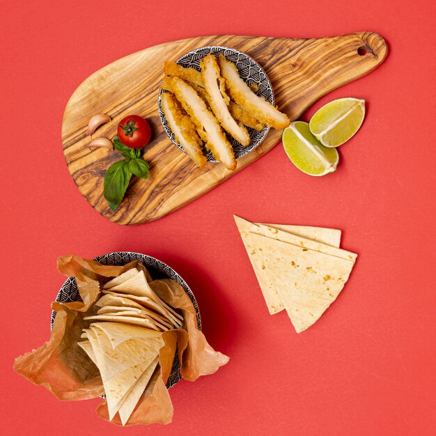 Homemade tortilla with lime and fried chicken