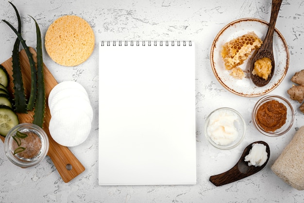 Free photo homemade treatment ingredients and notebook