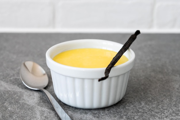 Free photo homemade vanilla custard on wooden table background