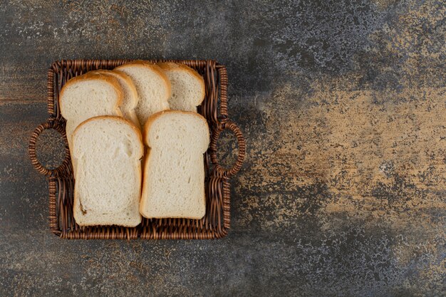 Homemade white bread in wooden basket