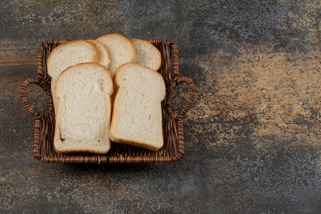 Homemade white bread in wooden basket