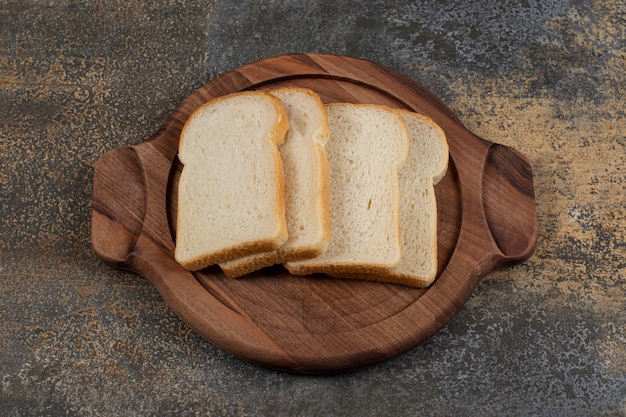 Homemade white bread on wooden board. 