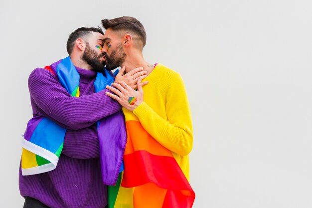 Homosexual sweethearts kissing and embracing