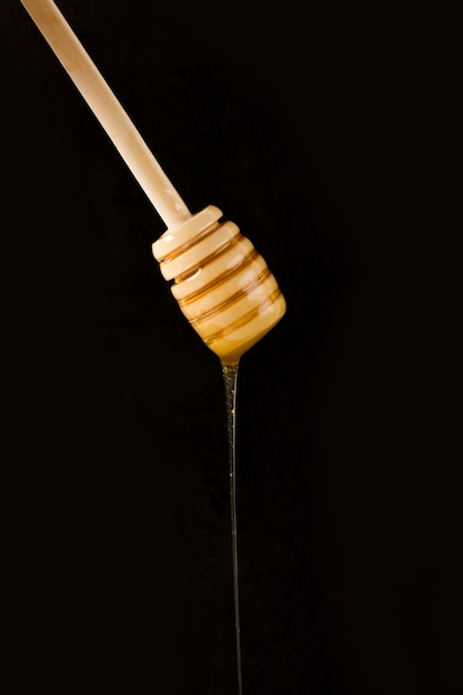 Honey falling from spoon