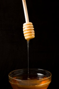 Honey falling from spoon