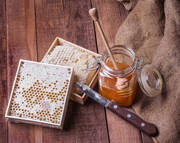 Download Premium Photo Jar With Honey Dipper And Chamomile On Yellow Background Space For Text PSD Mockup Templates