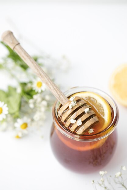 Honey in glass on table