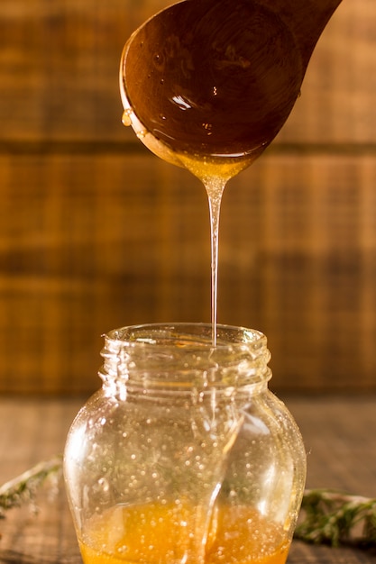 Honey jar being filled