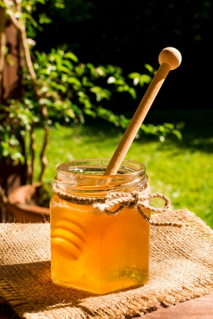 Free photo honey jar with spoon