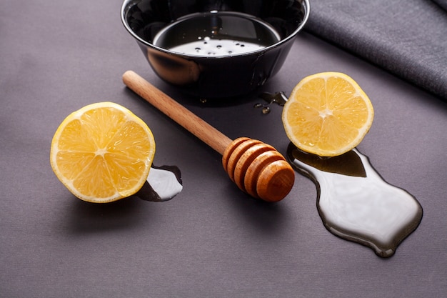 Honey stick and lemon slices with close-up