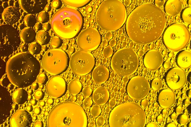 Honeycomb oil drops on golden hue
