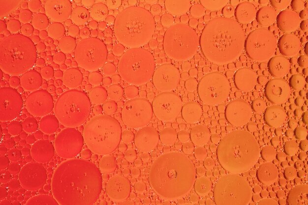 Honeycomb oil drops on orange hue