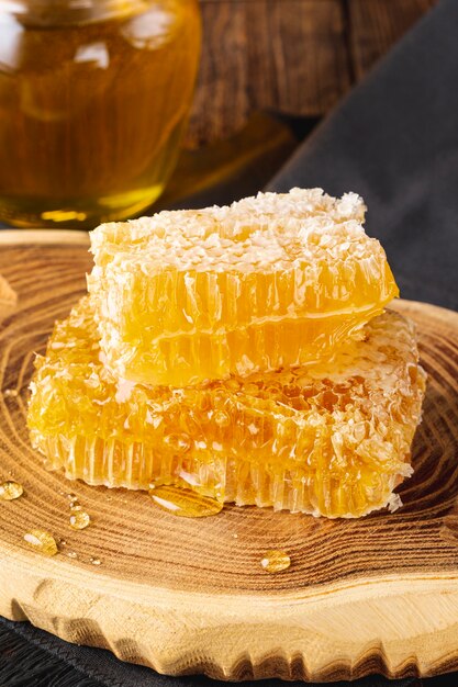 Honeycombs on wooden platter