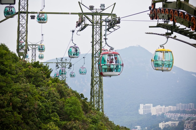 Hong kong, hong kong - october 01: cable cars over tropical trees in hong kong on october 01, 2012